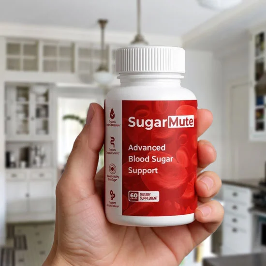 Hand holding SugarMute Advanced Blood Sugar Support bottle in a bright kitchen